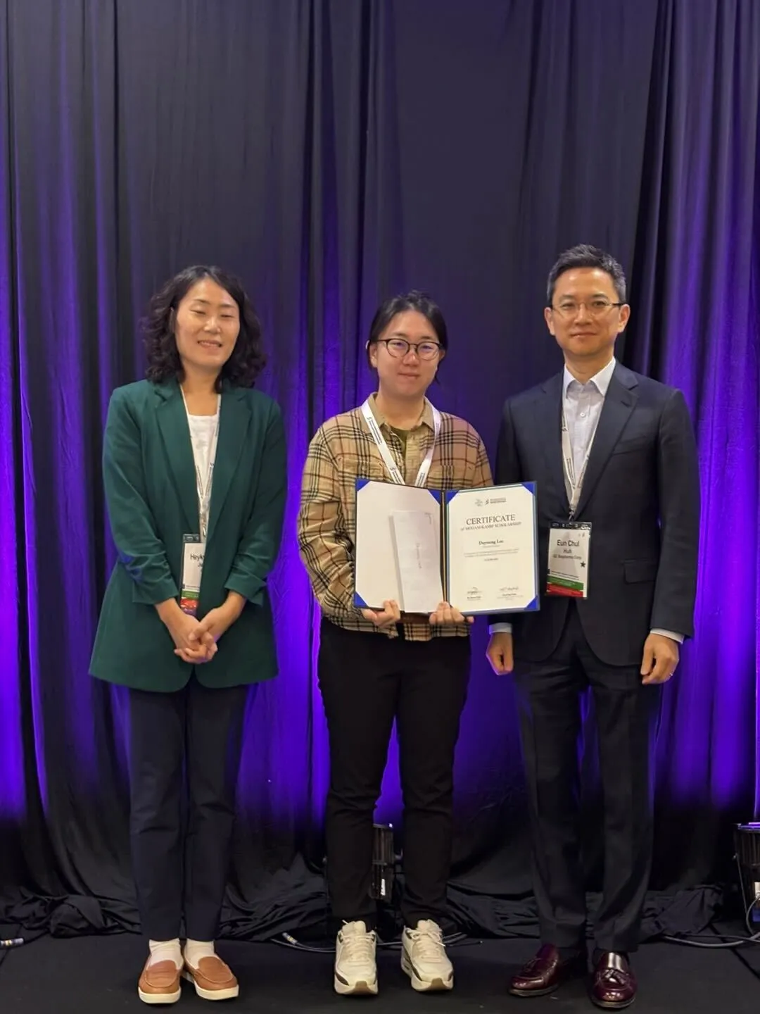 Gloria (middle) receives award from KASBP